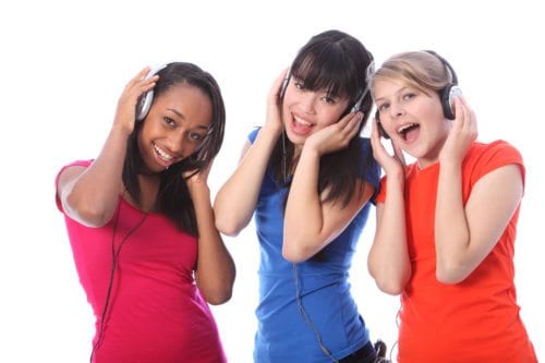 Teenage Girls Singing to music.