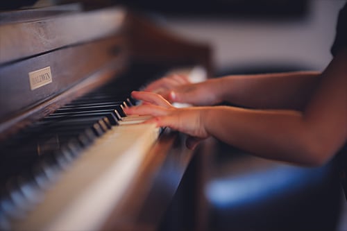 child playing a piano